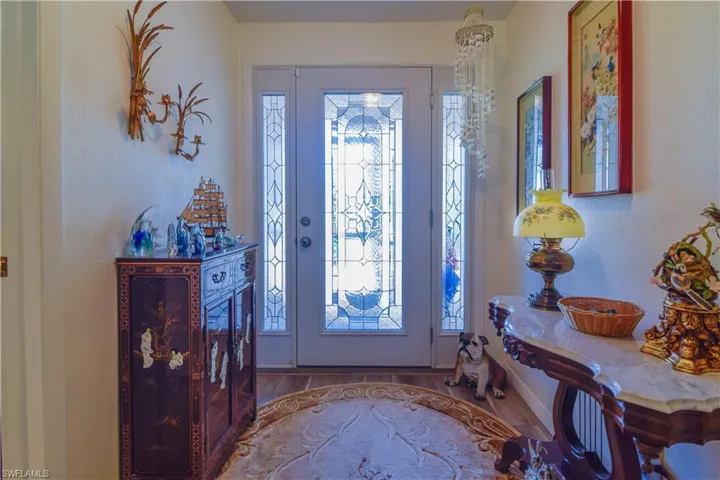 Entrance foyer with hardwood / wood-style flooring and plenty of natural light