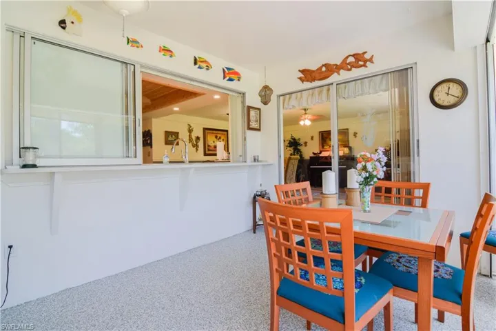 Dining space with sink and carpet flooring