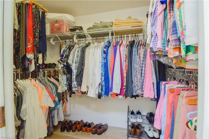 Walk in closet featuring hardwood / wood-style flooring