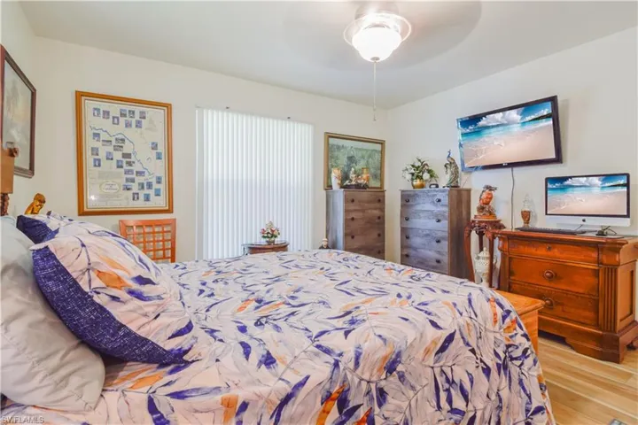 Bedroom with light wood-type flooring and ceiling fan