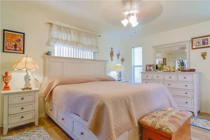 Bedroom with light wood-type flooring and ceiling fan