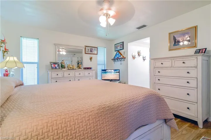 Bedroom featuring light wood-type flooring and ceiling fan