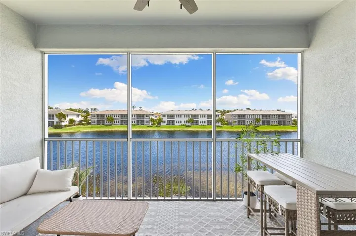Sunroom with a water view and plenty of natural light