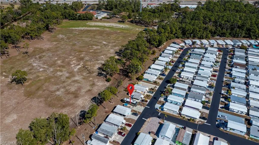 View of property location with nearby suburban area