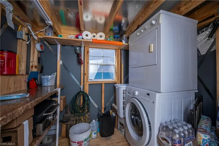 Laundry area with stacked washer / dryer