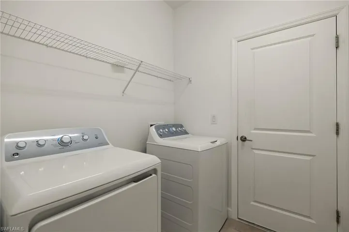 Washroom with washing machine and dryer
