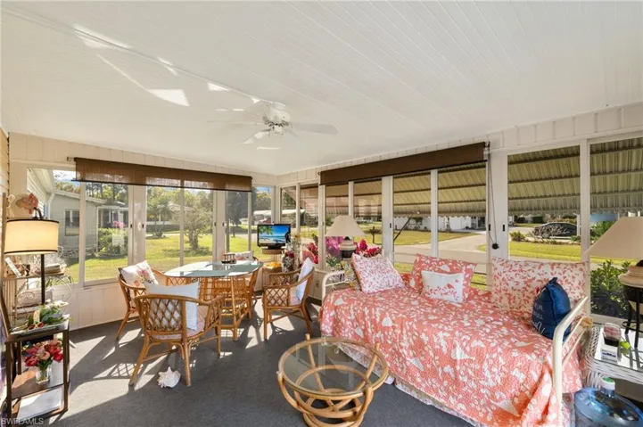 Sunroom / solarium featuring ceiling fan