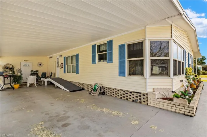 View of side of property with a patio area