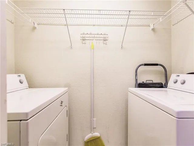 Laundry area with washing machine and clothes dryer