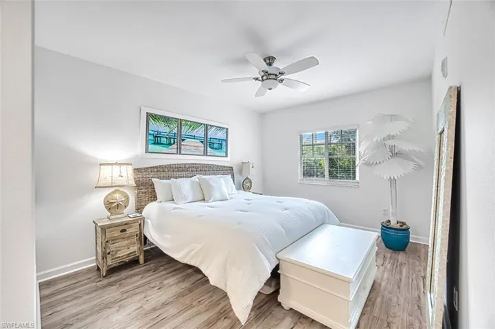 Bedroom featuring light wood-type flooring and ceiling fan