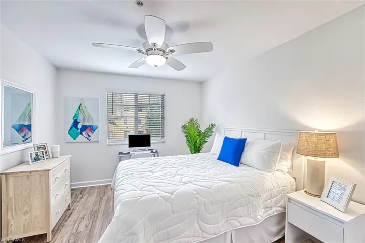Bedroom featuring light hardwood / wood-style floors and ceiling fan