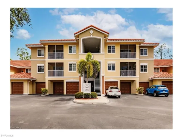 View of property featuring a garage