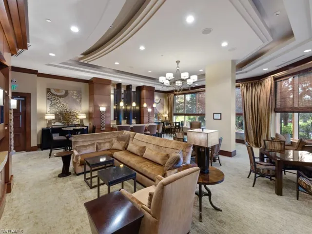 Formal social room with large screen TV, Bar & kitchen.