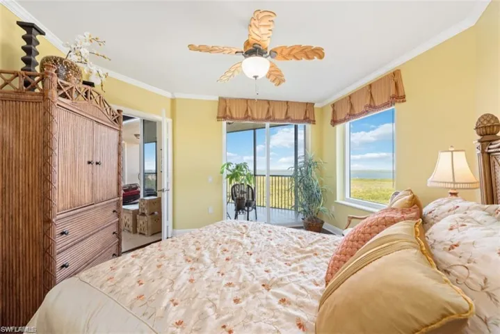 Guest suite with balcony access & water views.