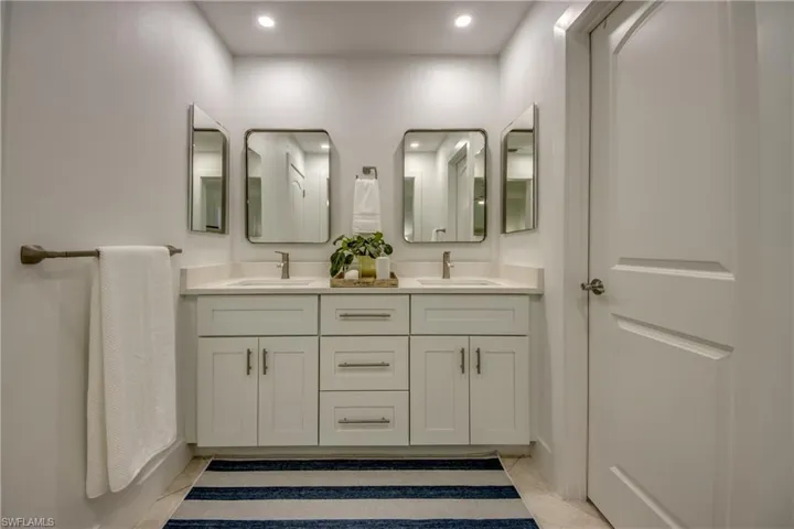 Bathroom featuring vanity and tile patterned floors