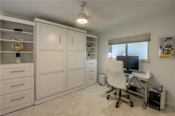 Office area with light tile patterned flooring