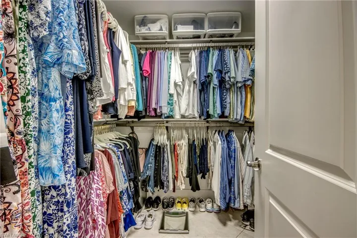 Spacious closet with tile patterned floors