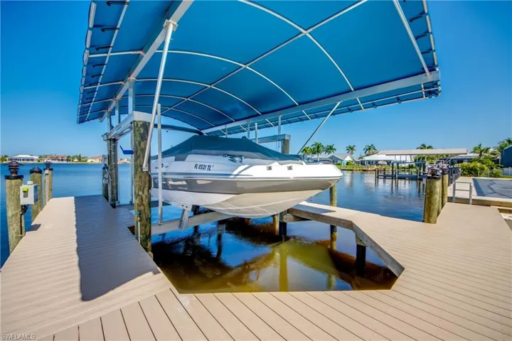 Dock area featuring a water view