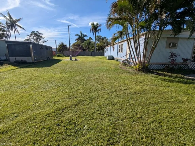 View of yard featuring fence