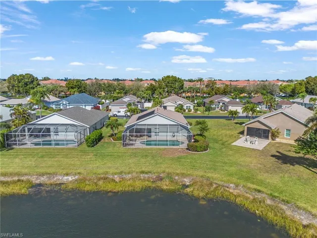 Aerial perspective of suburban area with a large body of water