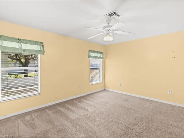 Master Unfurnished room with carpet floors and ceiling fan