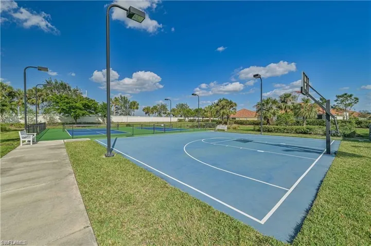 View of Community sport court with a yard