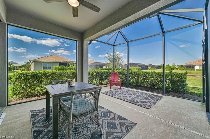 Sunroom / solarium featuring ceiling fan