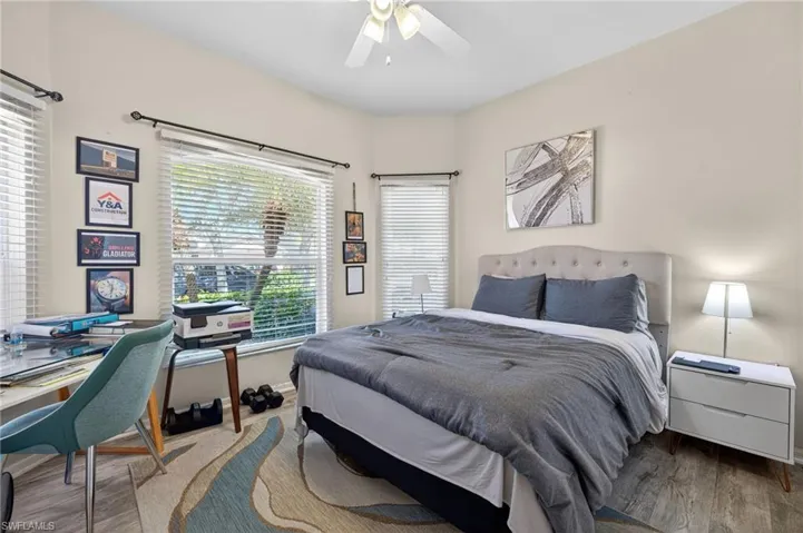 Bedroom featuring wood finished floors and a ceiling fan