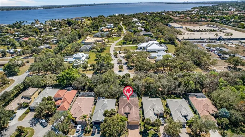 Aerial perspective of suburban area with a large body of water