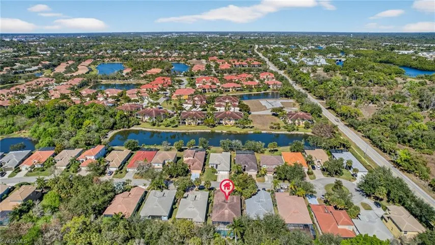 Aerial perspective of suburban area with a large body of water