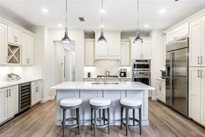 Stainless Monogram appliances, natural gas cooking, wine cooler