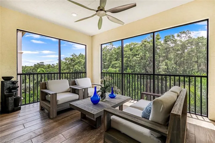 Screened lanai with tile flooring and private preserve view