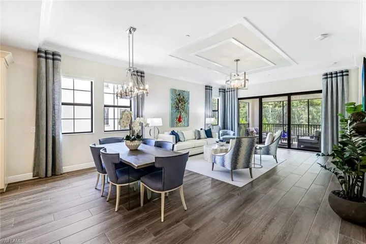 Great room blanketed in tile flooring and bathed in ample sunlight