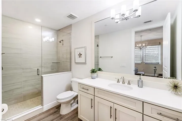Adjoining bath to guest suite with step-in shower
