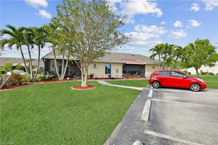 Single story home with a front lawn