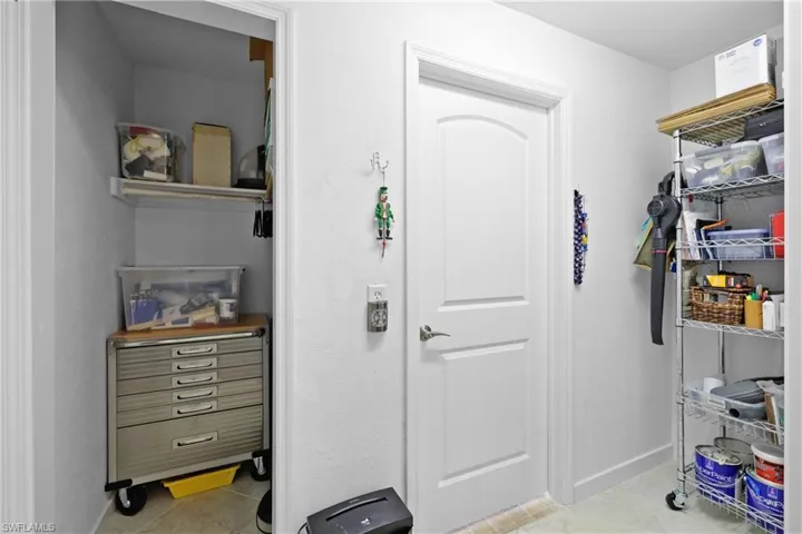 Spacious closet featuring light tile patterned flooring