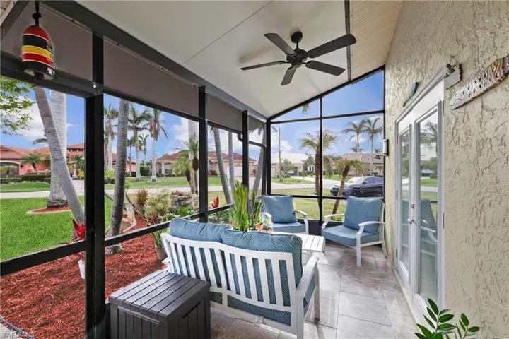Sunroom / solarium featuring ceiling fan