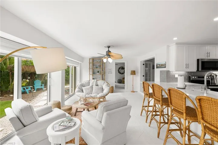 Living area featuring a ceiling fan and recessed lighting