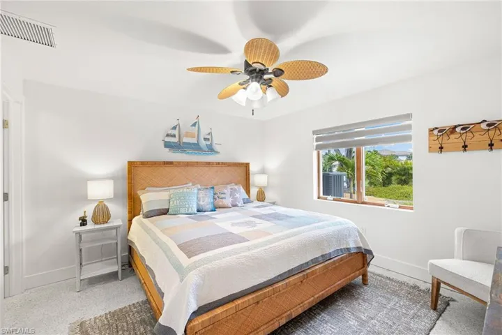 Bedroom featuring a ceiling fan and carpet flooring
