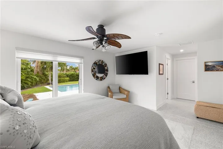 Bedroom featuring a ceiling fan, access to outside, and recessed lighting