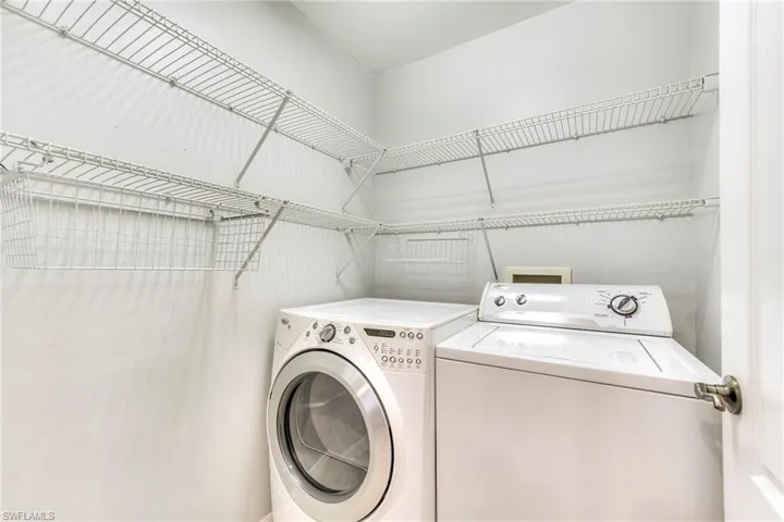 Laundry area with washing machine and clothes dryer