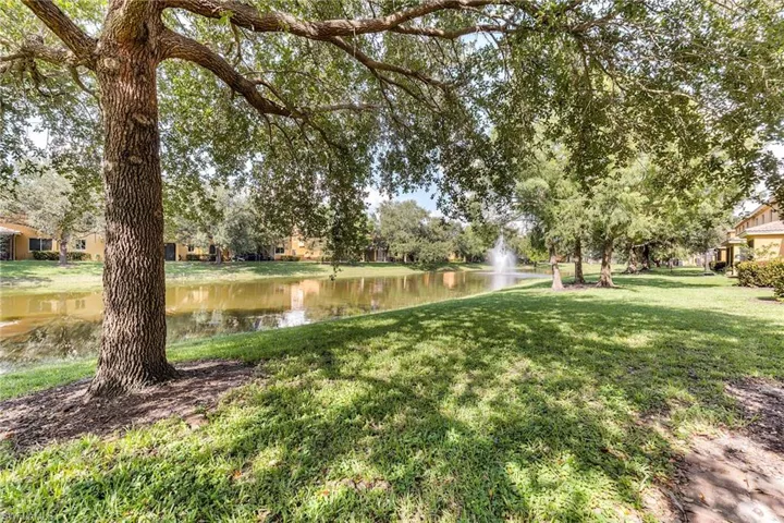 View of green lawn with a water view