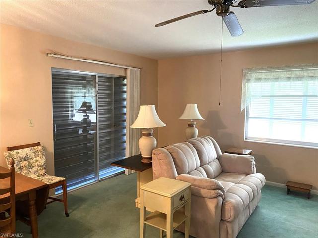 Sliding doors in Living Room leading to an outside sitting area.