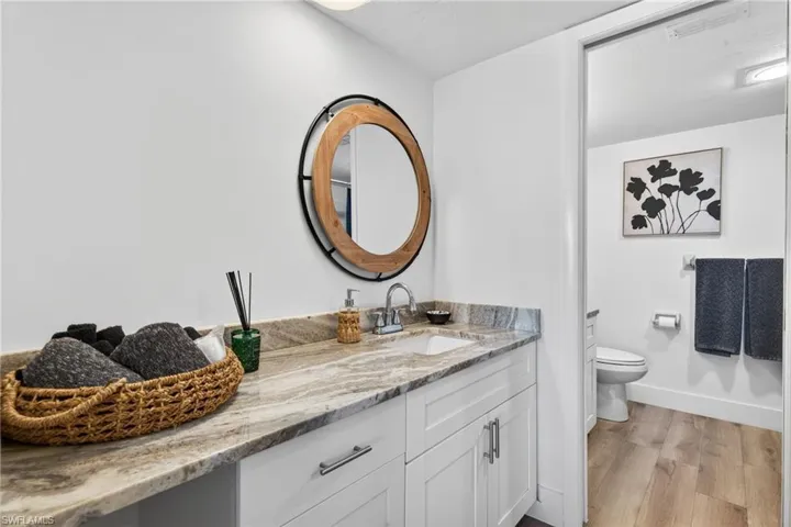 Bathroom featuring vanity and light wood finished floors