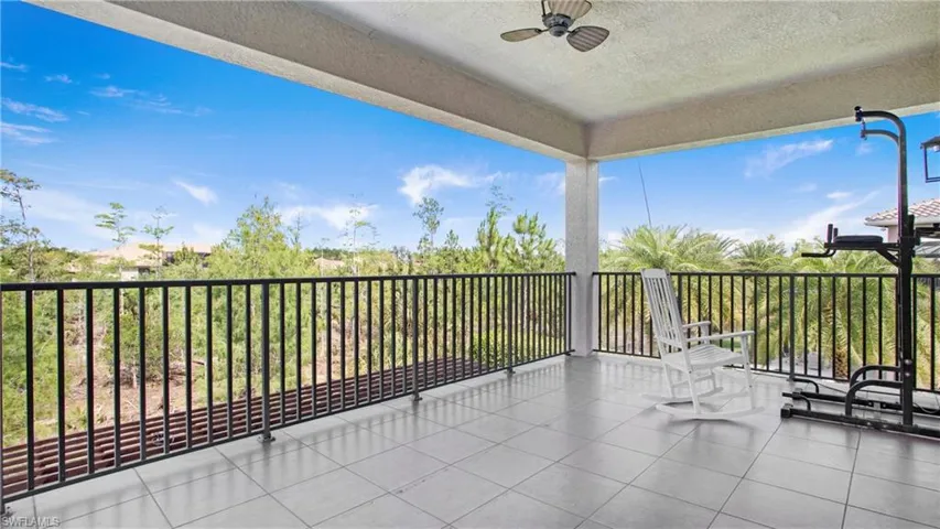 View of patio / terrace with a ceiling fan and a balcony