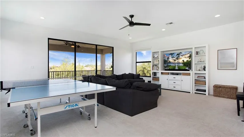 Rec room featuring a ceiling fan, light carpet, and recessed lighting