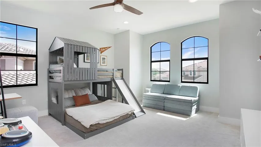 Bedroom with multiple windows, carpet floors, baseboards, and recessed lighting