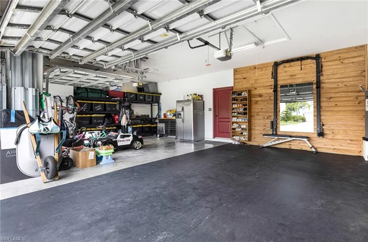 3-CAR Garage with gym mat