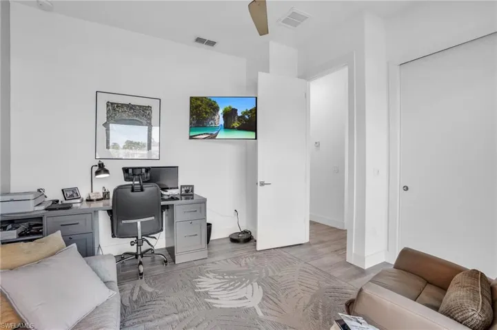 Home office featuring light hardwood / wood-style flooring
