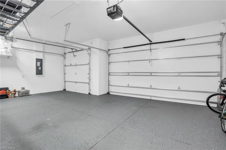 Garage featuring a garage door opener